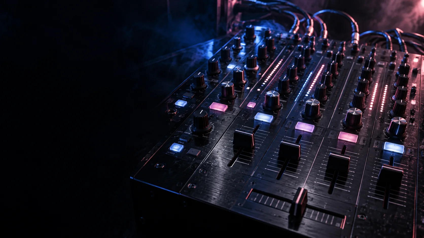 DJ mixer with illuminated faders and knobs under cobalt and rose light.