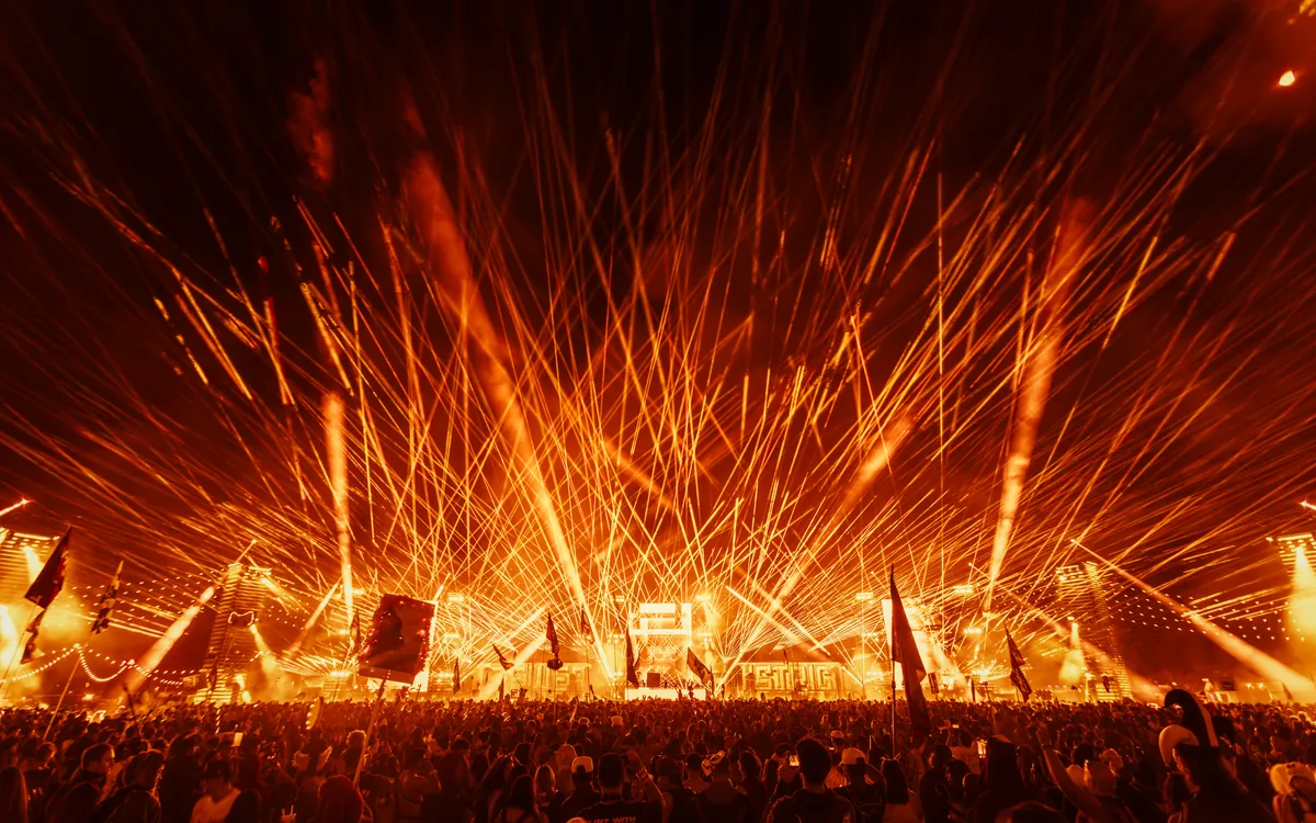 Fireworks and stage lights filling the sky at Escape Halloween
