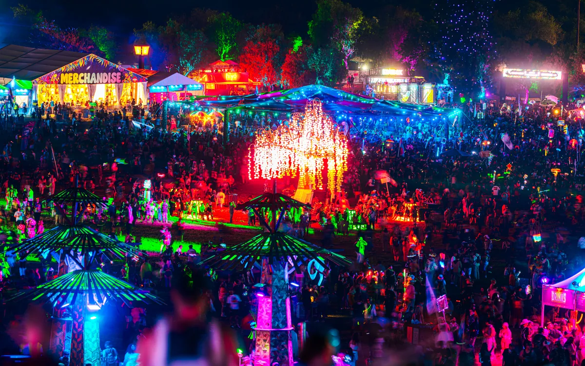 The colorful Nocturnal Wonderland grounds seen above the crowd